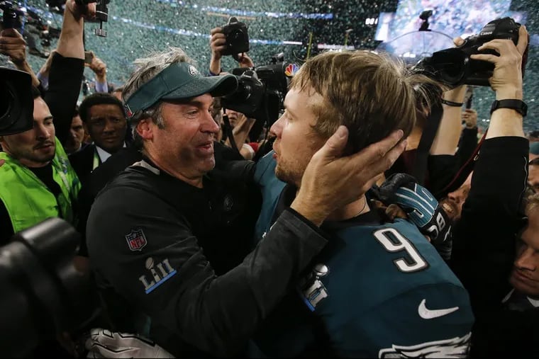 Eagles coach Doug Pederson and quarterback Nick Foles celebrates after beating the New England Patriots for the Super Bowl LII title on Sunday, February 4, 2018 in Minneapolis.