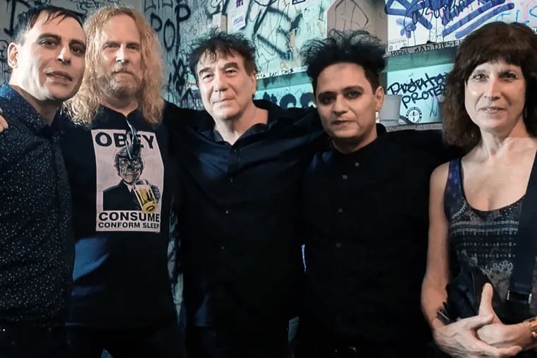 Mr. Heckman (center), stands with his wife, Gail DeLong (right), Jerry Bennett of Metropolis Records (second from left), and She Past Away band members Volkan Caner (left) and Doruk Öztürkcan.