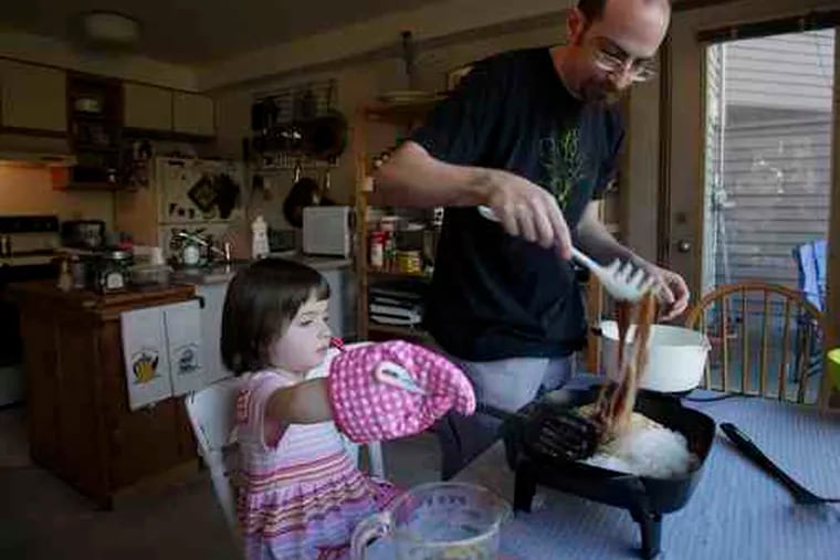 Matthew Amster-Burton (above) cooks up some &quot;Ants in a Tree&quot; (ground pork with noodles) with his 5-year-old daughter, Iris. Amster-Burton is the author of &quot;Hungry Monkey: A Food-Loving Father's Quest to Raise an Adventurous Eater.&quot;