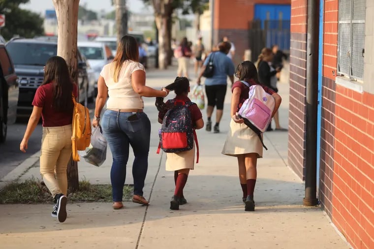 Students arrive for first day of school at the Luis Munoz-Marin School in North Philadelphia Monday morning.