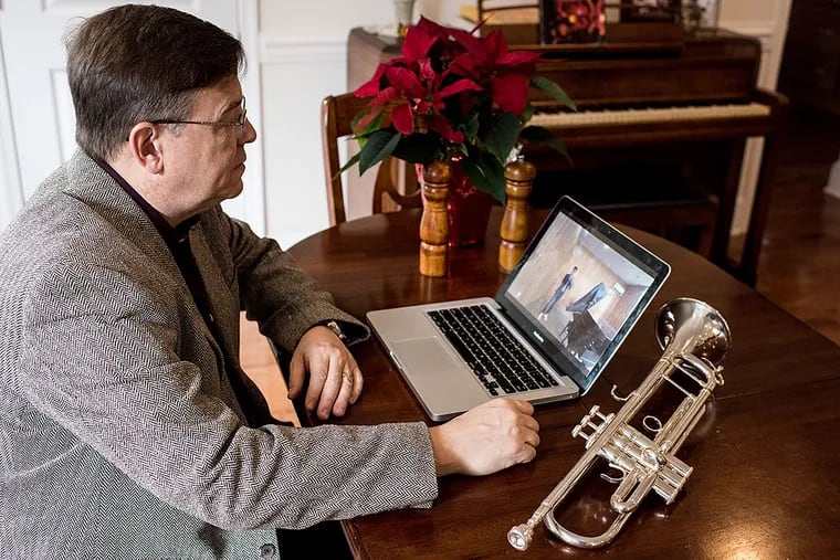 David Bilger, principal trumpeter of the Philadelphia Orchestra, at his home. David critiques and teaches Ahmadbaset Azizi, 17,  who lives in Kabul, Afghanistan.