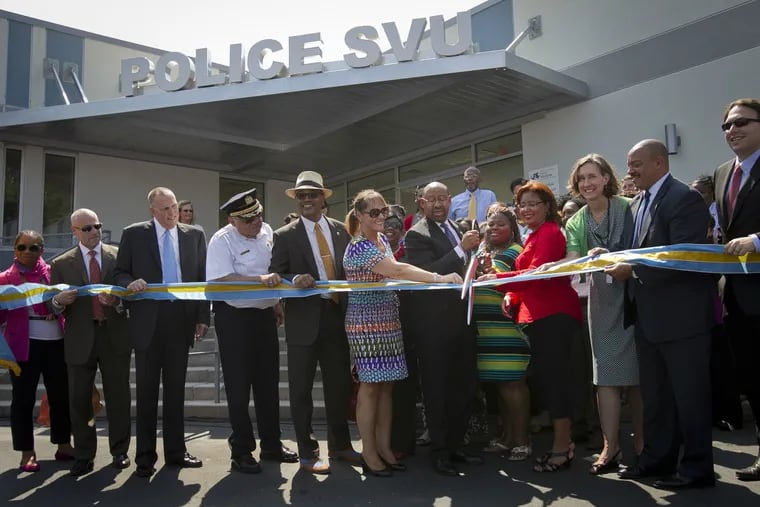City dignitaries gathered in 2013 to cut the ceremonial ribbon of the new Philadelphia Police Department's Special Victims Unit.