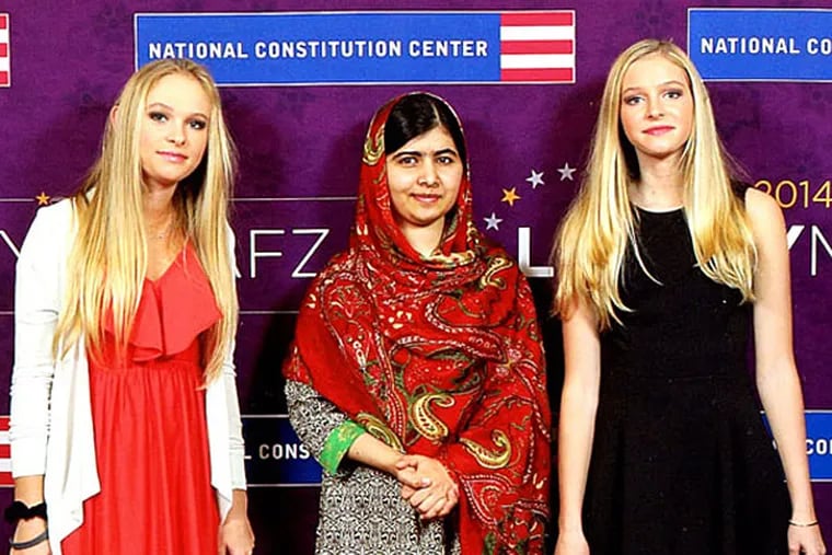 From left: Alura Potamkin, Malala Yousafzai and Ayla Potamkin at the Liberty Medal ceremony.