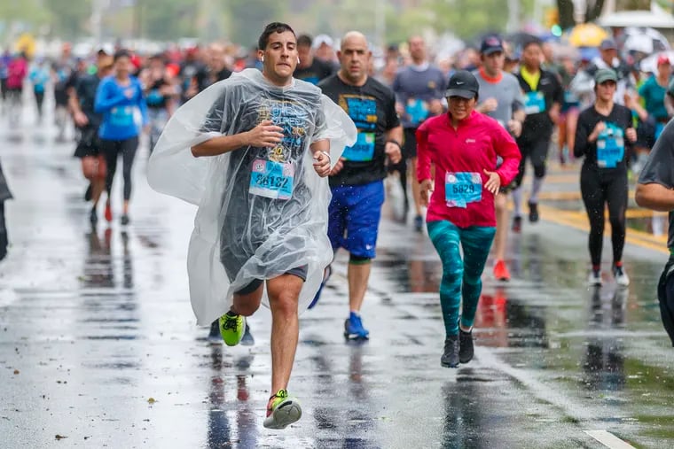 Harrison Newman, from Voorhees, NJ, wrapped himself in plastic in order to stay dry during his run at the 2019 Broad Street Run on May 5, 2019