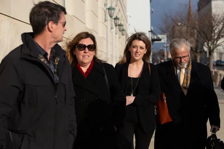 Kate McClure walks out of US Courthouse in Camden next to attorney, James Gerrow, (right) and her parents after pleading guilty to being a co-conspirator in a $400,000 GoFundMe campaign scam Wednesday, March 6, 2019.