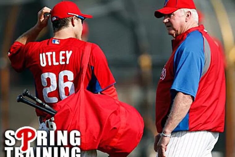 Chase Utley and Charlie Manuel talk during a morning session in Clearwater on Thursday. (David Maialetti/Staff Photographer)