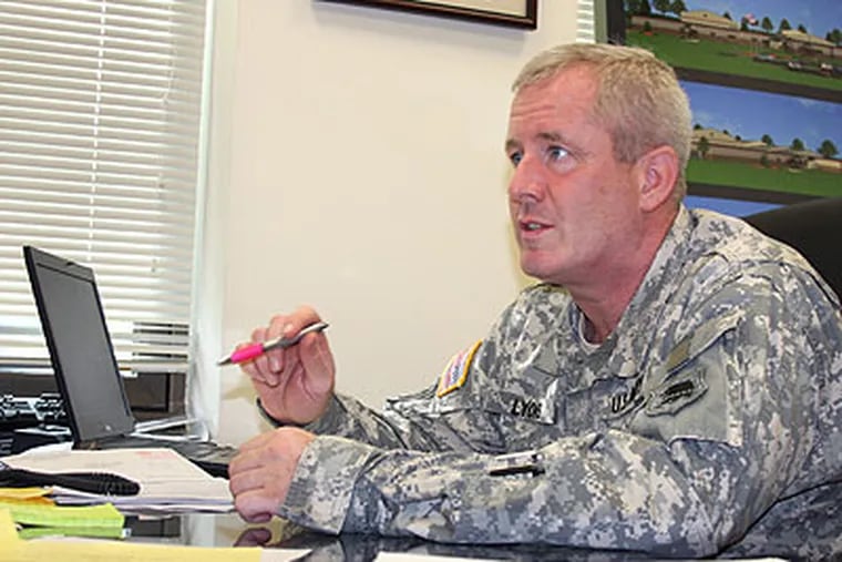 N.J. Army National Guard Lt. Col. Mike Lyons at work in his office at the Department of Military and Veterans Affairs Headquarters in Lawrenceville. (Photo by Sgt. Wayne Woolley)