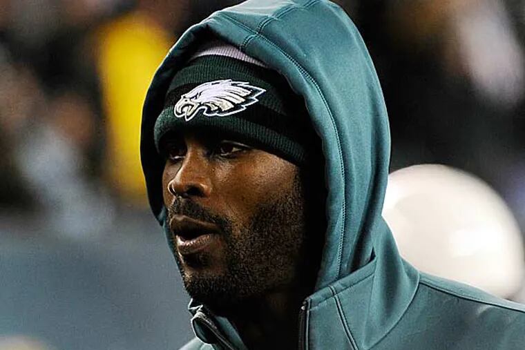 Philadelphia Eagles' Michael Vick walks the sidelines in the first half of an NFL football game against the Cincinnati Bengals, Thursday, Dec. 13, 2012, in Philadelphia. (Michael Perez/AP)