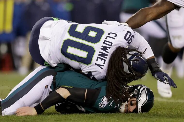 Seattle Seahawks defensive end Jadeveon Clowney lands on Eagles quarterback Carson Wentz during the first quarter of the game on Sunday, January 05, 2020 at Lincoln Financial Field in Philadelphia.