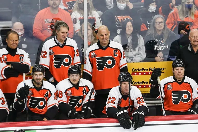 Rick Tocchet (center) during a Flyers alumni game at the Wells Fargo Center.