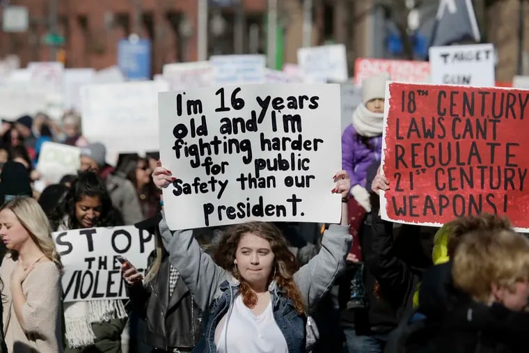 Springfield High School sophomore Deborah Persico, 16, marches during the March for Our Lives march and rally in Philadelphia on March 24, 2018.