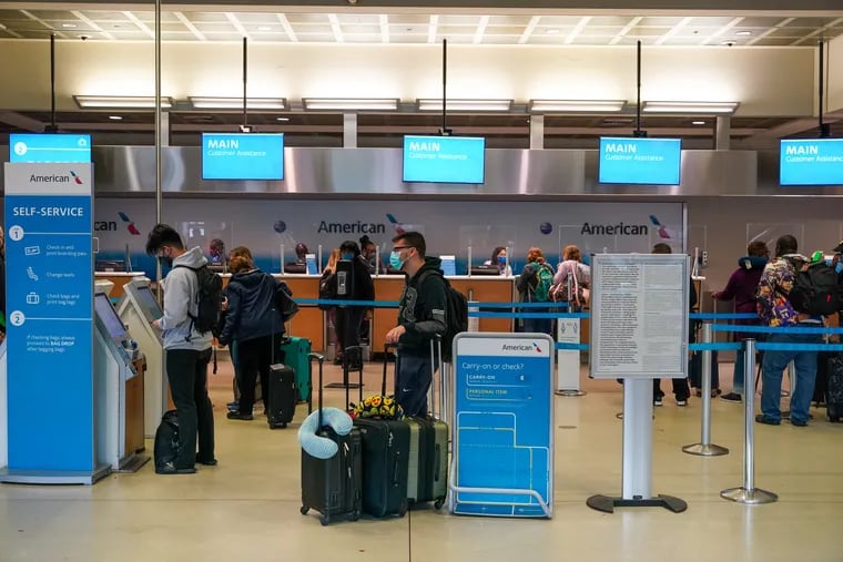 Passengers checking in at Philadelphia International Airport on Nov. 12, 2021.