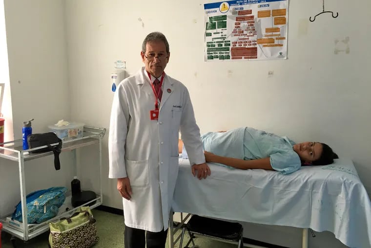 Jack Ludmir, OB/GYN chair at Pennsylvania Hospital, with a patient who is being evaluated for possible Zika infection in Cali, Colombia, on Monday 2.8.2016. Ludmir is on sabbatical in Colombia, working with the government and medical organizations to improve obstetrical care. (Note: He is not doing clinical work with patients but is going on rounds and reviewing cases with medical students and residents.)