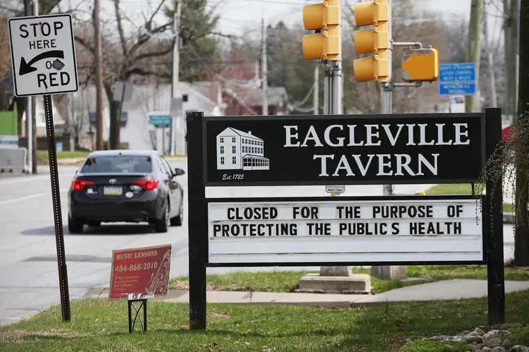 A sign notes that the Eagleville Tavern in Eagleville, Pa., is closed during the ongoing coronavirus pandemic on Wednesday, March 18, 2020.