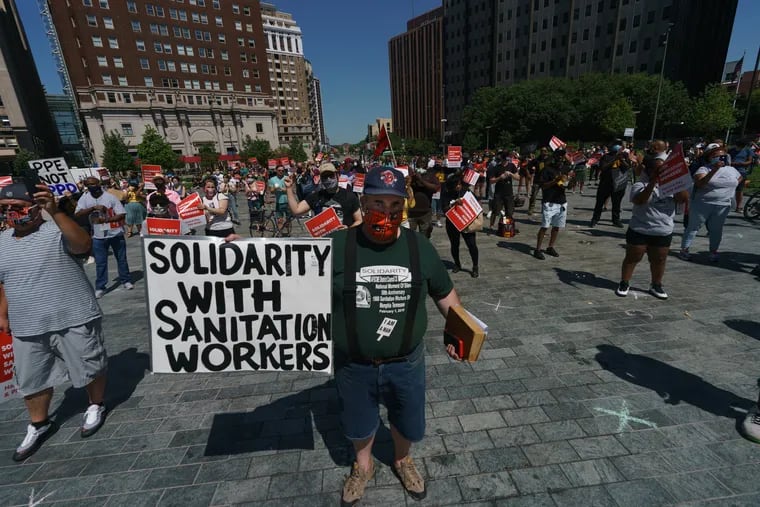 Attendees at a rally and protest to support sanitation workers who are requesting hazard pay and PPE, engage in a social distancing protest at LOVE Park, in Philadelphia, June 09, 2020.