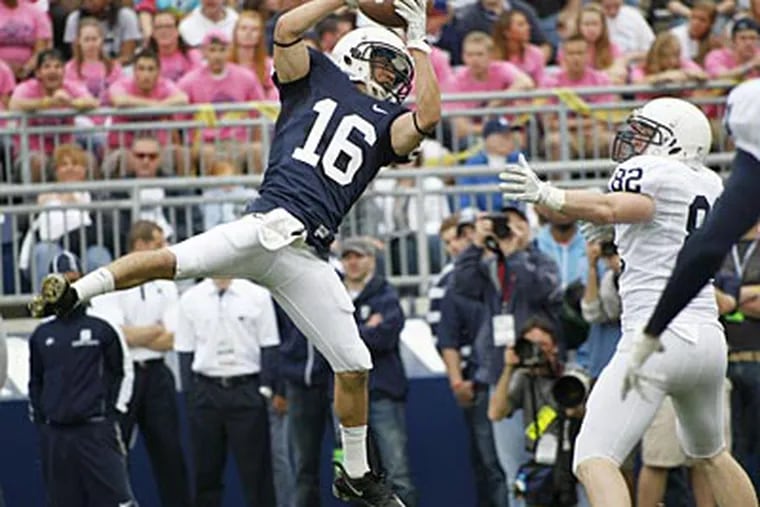 Devin Pryor intercepts a pass intended for Brian Irvin during the annual Blue-White Game. (Keith Srakocic/AP)