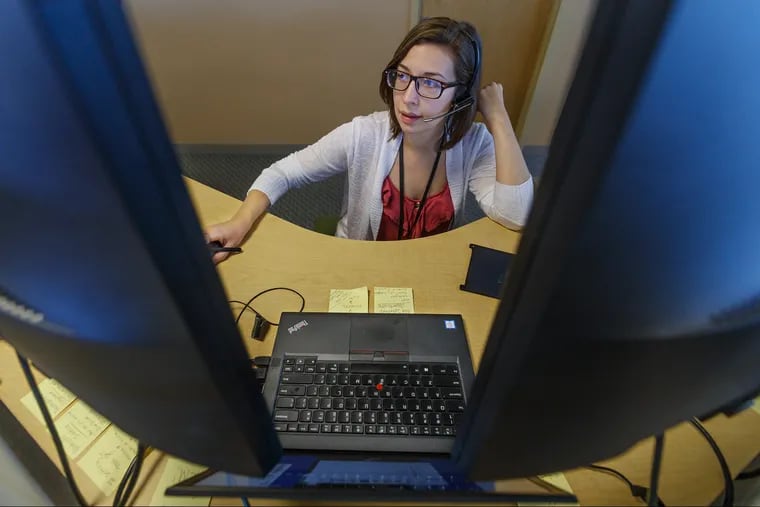 Jodi Galgon, a health assistant at Accolade, surrounded by computer monitors, spoke to a client on the phone about their healthcare benefits in November 2018. Accolade is buying 2nd.MD, which helps patients get second opinions from specialists, for up to $460 million.