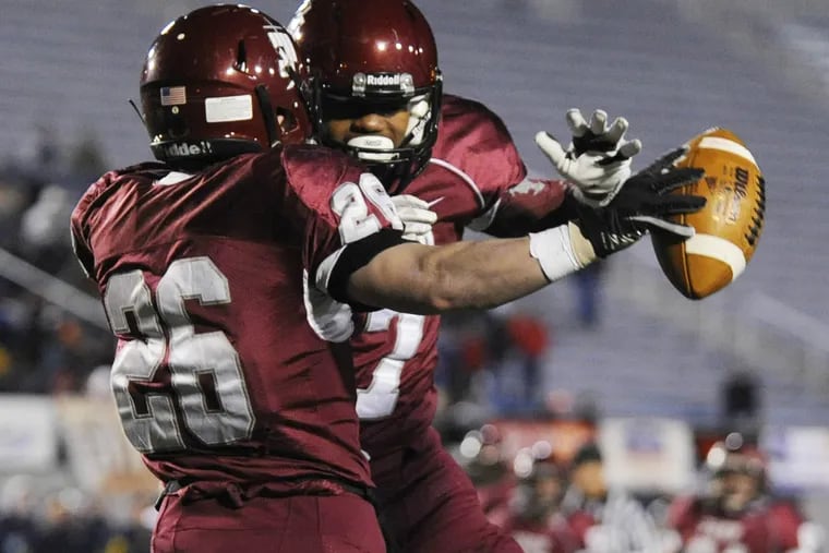 St. Joseph’s Prep’s Vince Moffet (left) celebrates his first-quarter touchdown with D’Andre Swift in PIAA Class AAAA title game.