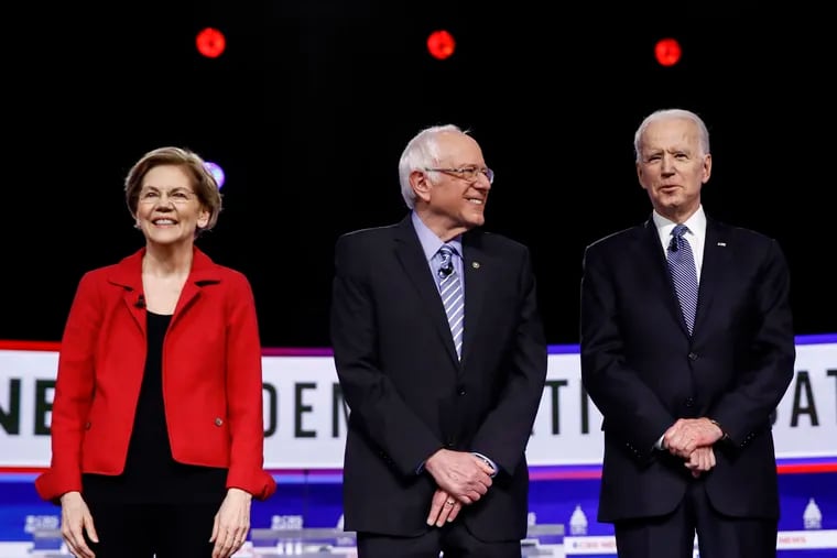 Former presidential candidates Elizabeth Warren (left) and Bernie Sanders (center) have notably stopped short of endorsing Joe Biden (right) to this point.