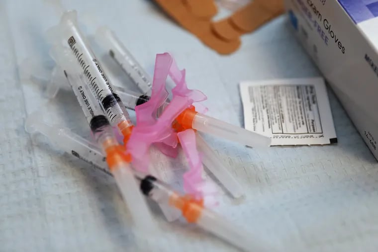 Syringes containing COVID-19 vaccine pictured on a tray during a clinic in North Philadelphia April.