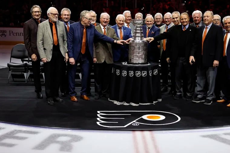 Members of the 1973-74 Flyers Stanley Cup team were in the house with the Cup before Friday night's alumni game.