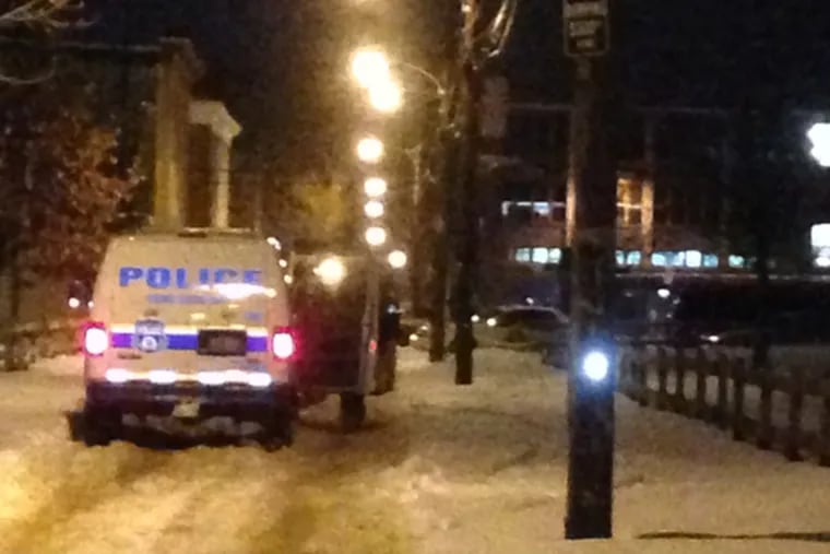 The scene at the Norman Blumberg Apartments in North Philadelphia this morning, Jan. 27, 2014.  A law enforcement officer shot a suspect in the area this morning during a chase that began near the housing complex owned by the Philadelphia Housing Authority. (Emily Babay / staff)