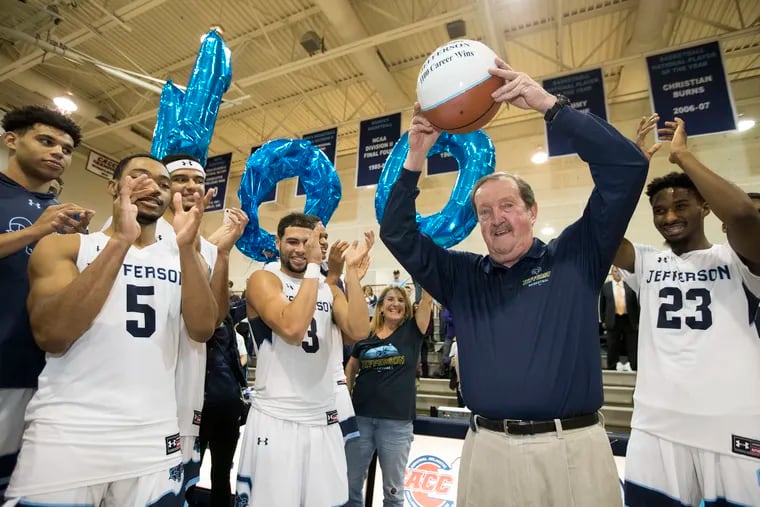 Coach Herb Magee of Jefferson University is applauded by his team after getting win number 1100 against Kutztown on Nov. 19, 2019.