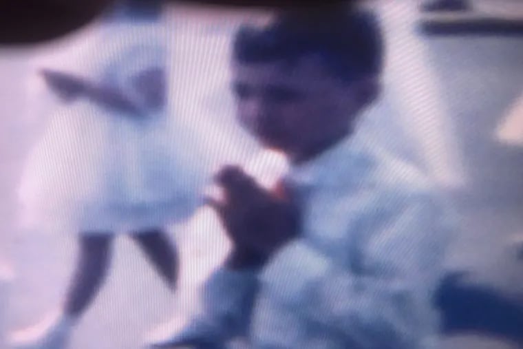 A home movie image of the columnist in a procession of boys and girls making their First Holy Communion at St. Francis Church in North Adams, MA. in 1961.