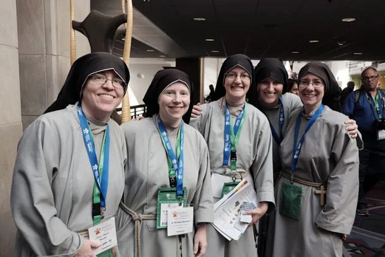 Sisters with the Franciscans of the Renewal, from New York City, pose for a group photo while attending the World Meeting of Families at the Pennsylvania Convention Center. (Ed Hille/Staff Photographer)