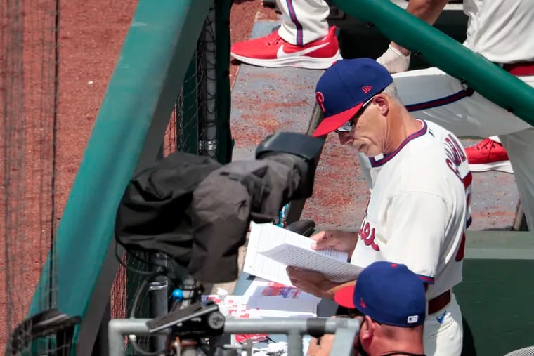 Phillies head coach Joe Girardi at work in the dugout at Citizens Bank Park.
