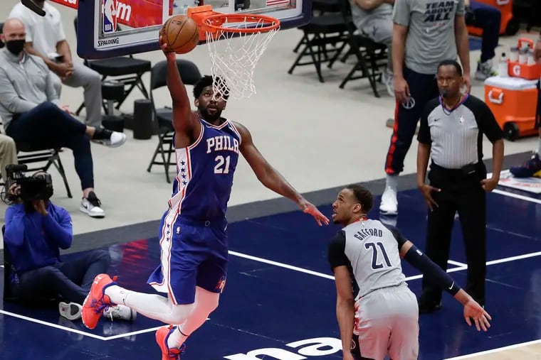 Sixers center Joel Embiid goes in for a lay up Wizards center Daniel Gafford during the third quarter in Game 3  of their first-round playoff series in Washington D.C.