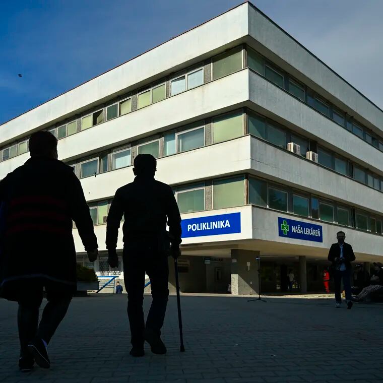 People walk outside the F. D. Roosevelt University Hospital, where Slovak Prime Minister Robert Fico, who was shot and injured, is treated in Banska Bystrica, central Slovakia, on Thursday.