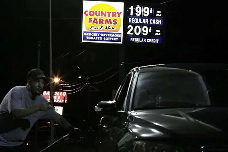 Jim Murray pumps gas. One gallon of regular unleaded gas cash price has been 1,99 since last Fri, at the Country Farms Fuel and More store at 2403 Marne Hwy in Hainesport NJ. The store is open 6am-10pm everyday. This photo taken on August 23, 2015.   ( ELIZABETH ROBERTSON / Staff Photographer )
