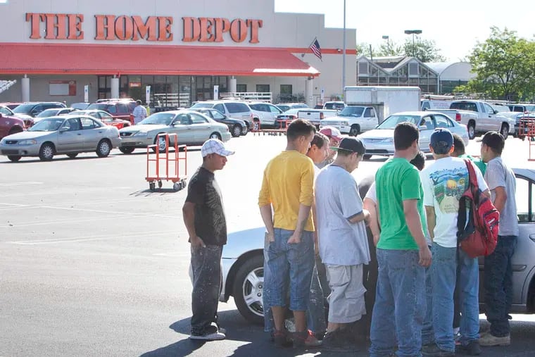 A group of day laborers solicit work from potential client in parking lot of Home Depot. Philaposh, Philadelphia Area Project on Occupational Safety and Health, met with day laborers at Home Depot on Roosevelt Blvd in northeast Philadelphia on Thursday, August 14, 2014. ( ALEJANDRO A. ALVAREZ / STAFF PHOTOGRAPHER )