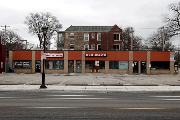 A parking lot in the Village of Oak Park, Ill., sits empty where small businesses are closed, Friday, March 20, 2020. Here are nine steps small businesses can take to save their businesses.  (AP Photo/Charles Rex Arbogast)