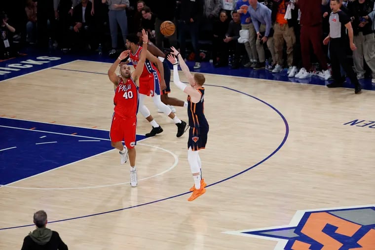 Knicks Donte DiVincenzo hits a three point basket over Sixers Nicolas Batum for the lead 102-101 during the fourth quarter of Game 2 of the NBA Eastern Conference playoffs at Madison Square Garden in New York on Monday.