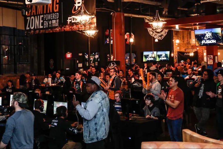 The watch party got pretty heated for Philadelphia Fusion, the Comcast Spectacor-owned competitive e-gaming team, on Thursday April 5 at Revolutions Bowl, 1009 Canal Street, Philadelphia. The night included giving away 500 t-shirts, in front of a giant screen. Such parties are part of the Fusion’s strategy to  establish a fan base in Philadelphia while the e-games are played in California this year.