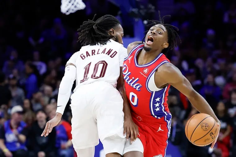 Sixers guard Tyrese Maxey gets fouled by Cleveland Cavaliers guard Darius Garland during his team's win on Friday night.