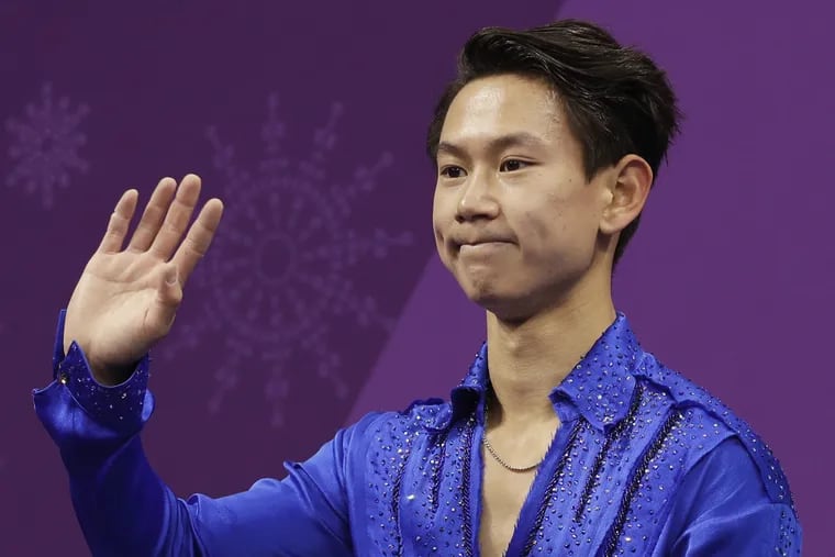 Figure skater Denis Ten, of Kazakhstan, reacts as his score is posted following his performance in the men's short program figure skating, in the Gangneung Ice Arena at the 2018 Winter Olympics in Gangneung, South Korea.
