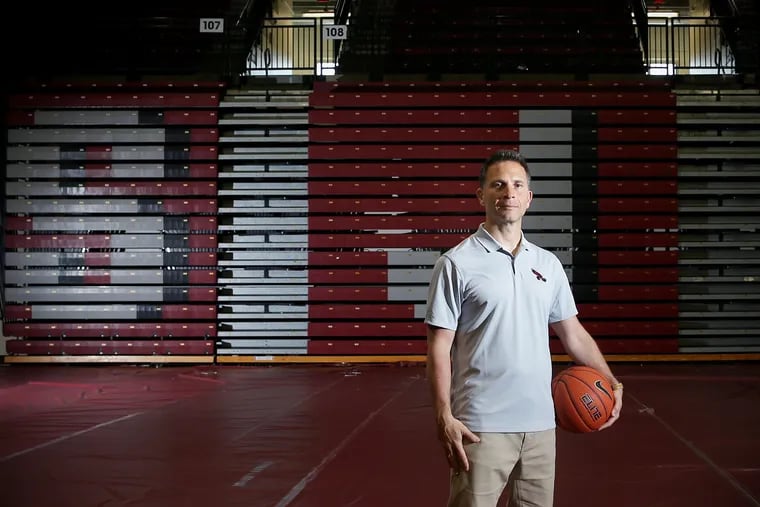 New St. Joseph's coach Billy Lange stands for a portrait inside Hagan Arena.