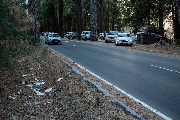 A road lined with trash in Yosemite National Park, Calif., on Monday.