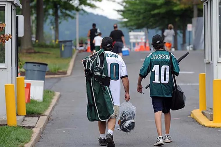Eagles fans leave the complex after practice with memorabilia in hand during training camp at Lehigh University. (Tom Kelly IV / Staff Photographer)