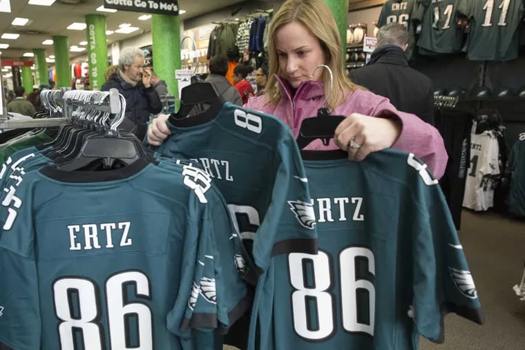 Dana Shaeffer, from Delran, New Jersey, shops for Eagles apparel at Modell&#039;s Sporting Goods on the 1500 block of Chestnut Street, in Philadelphia, the day after the Philadelphia Eagles beat the Minnesota Vikings in the NFC Championship, Monday, Jan. 22, 2018, in Philadelphia. JESSICA GRIFFIN / Staff Photographer