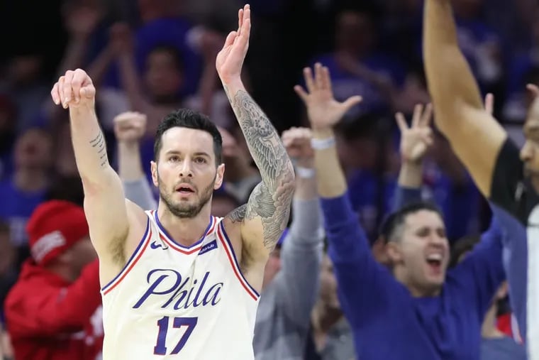 JJ Redick of the Sixers celebrates after hitting a 3-pointer with 1:34 left to go in their game against the Cavaliers during the 4th quarter at the Wells Fargo Center on April 6, 2018.