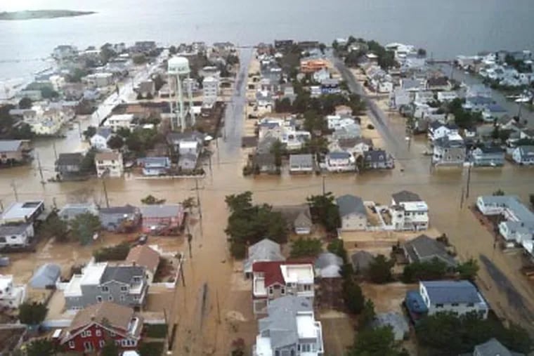 An aerial view of Brant Beach in Long Beach Island, N.J., where the bay met the ocean during Hurricane Sandy on Monday (Troy J. Graham / Staff). <a href="http://www.philly.com/philly/gallery/Helicopter_Views_of_Shore_Devastation.html"><B>View more aerial photos of shore devastation.</b></a>