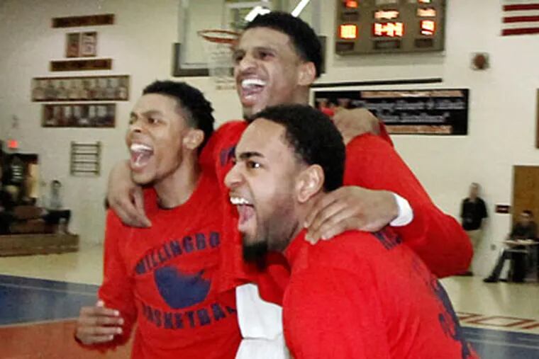 Willingboro players celebrate their program's first sectional title. (Elizabeth Robertson/Staff Photographer)