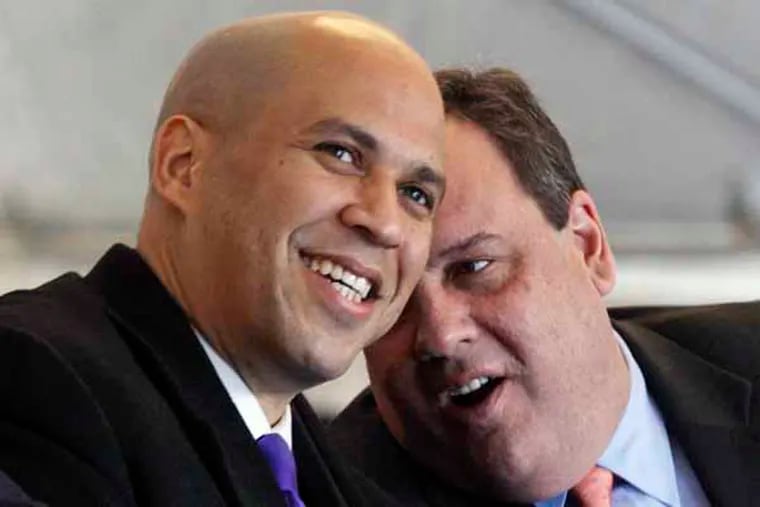 FILE - In this Thursday, Feb. 9, 2012 file photograph, New Jersey Gov. Chris Christie, right, talks with Newark Mayor Cory A. Booker, during a ceremony in Newark, N.J.  On Thursday, Dec. 20, 2012, Booker ruled out a bid for New Jersey governor and is eyeing a run for U.S. Senate in 2014. Booker's announcement on Twitter Thursday ended months of speculation over whether the Democratic Party's biggest draw would seek to challenge Gov. Chris Christie in next year's governor's race. (AP Photo/Mel Evans, file)