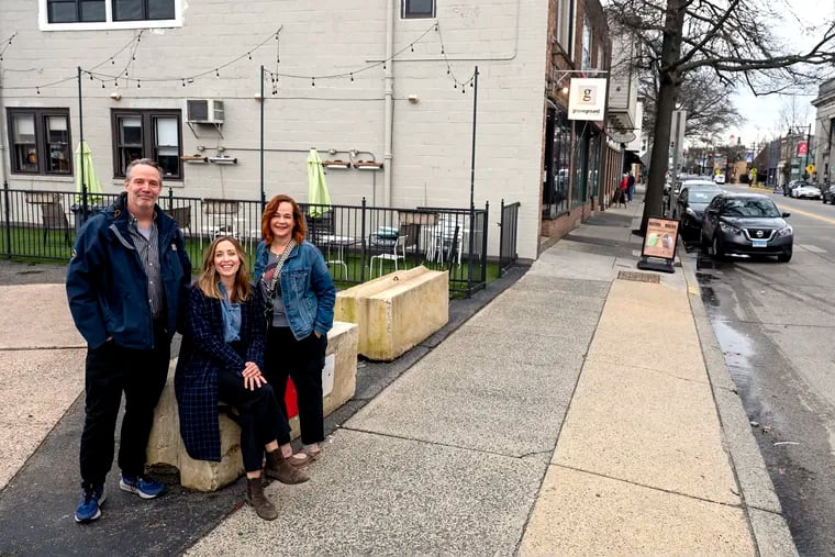 Collingswood Borough Commissioner Rob Lewandowski; Lindsey Ifill, a member of the Collingswood Green Team, and Sandi Kelly, also of the Green Team, in front of the an empty lot, which will become a pocket park with seating, rain barrels, native plants, bike racks, and a mural.
