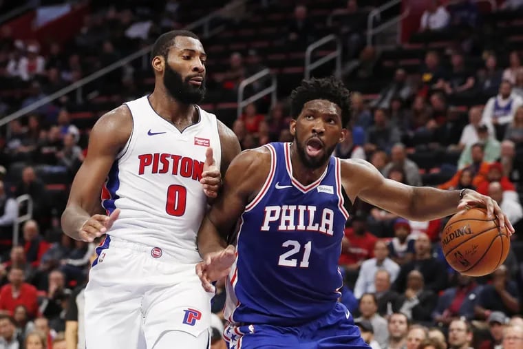Sixers center Joel Embiid was caught flopping to get Andre Drummond (left) ejected on Tuesday night.