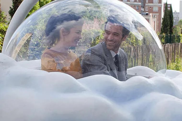 Colin and Chlo (Romain Duris and Audrey Tautou) on an adventure in a cloud-shaped gondola car in "Mood Indigo."